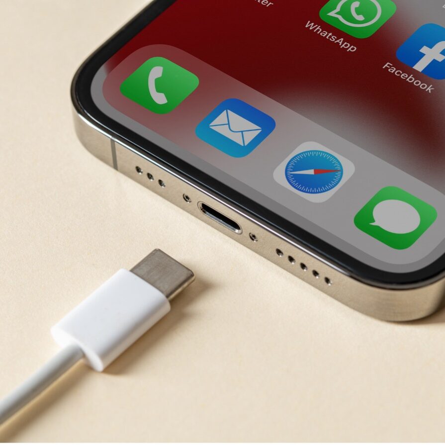 Lightning cable sitting unplugged next to an iPhone